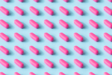 pink pill pattern on a baby blue surface