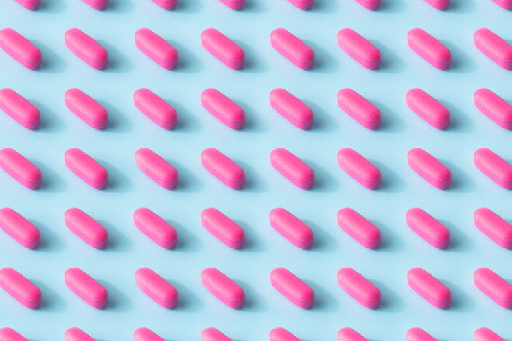 pink-pill-pattern-on-a-baby-blue-surface