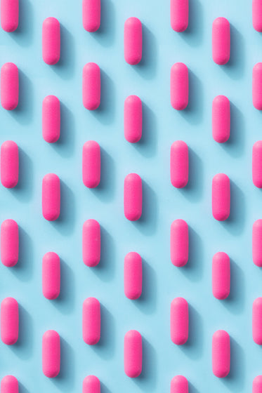 pink pill pattern on a blue background