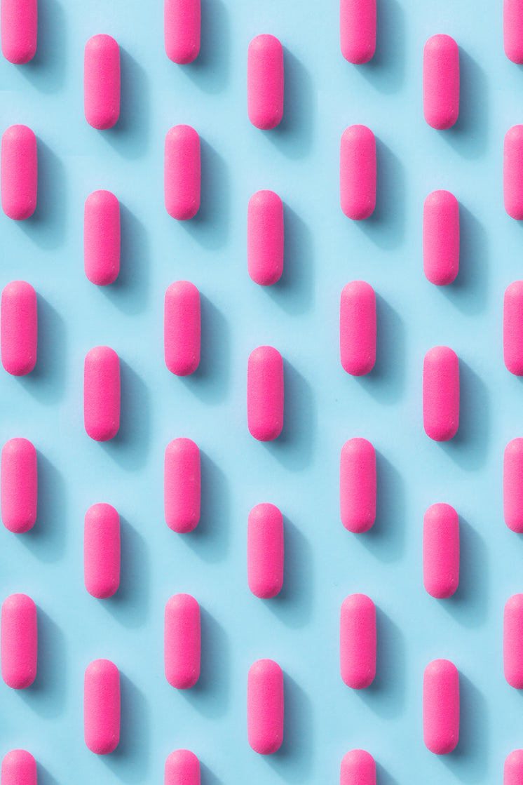 Pink Pill Pattern On A Blue Background