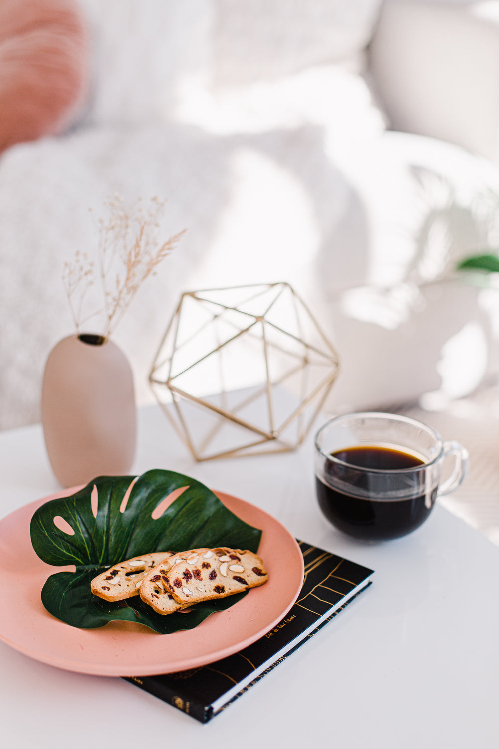 pink plate and black coffee in a living room setting