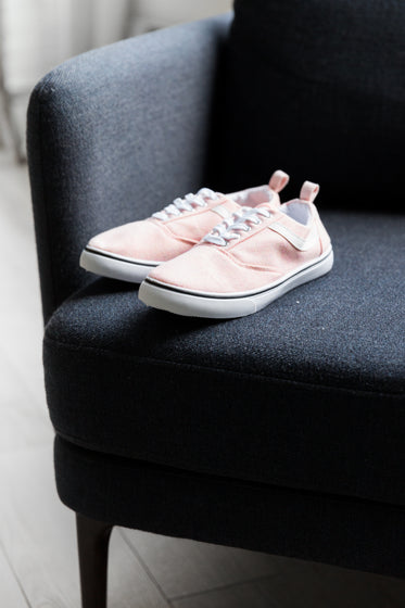 pink pumps on black chair