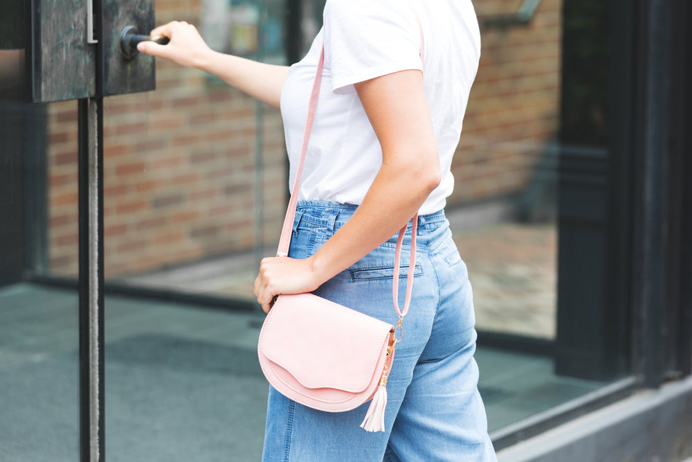 pink purse with tassel