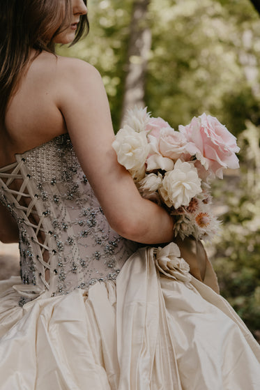 pink rose wedding bouquet held by bride