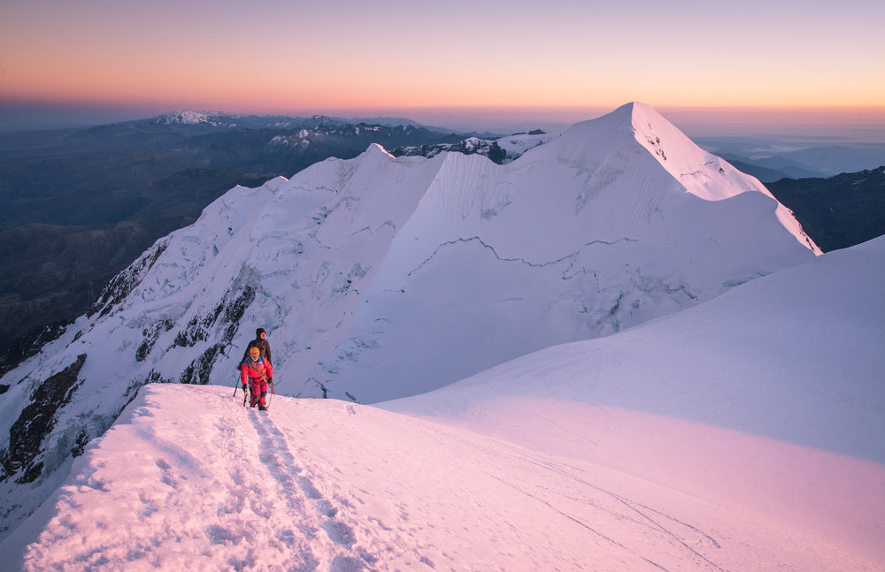 pink snow covered mountain tops