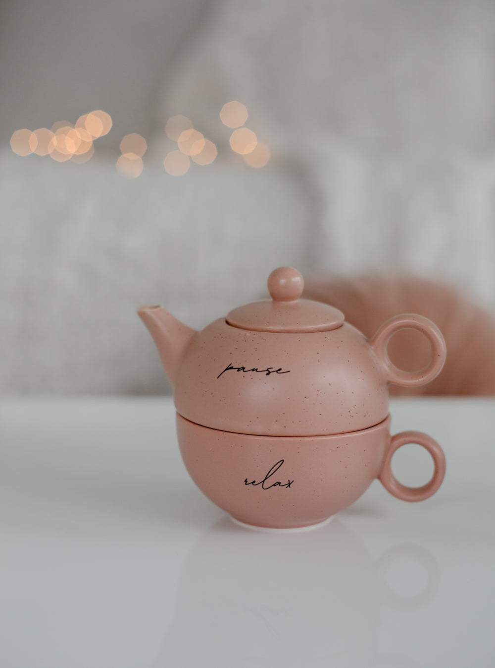 pink teapot with pause and relax written