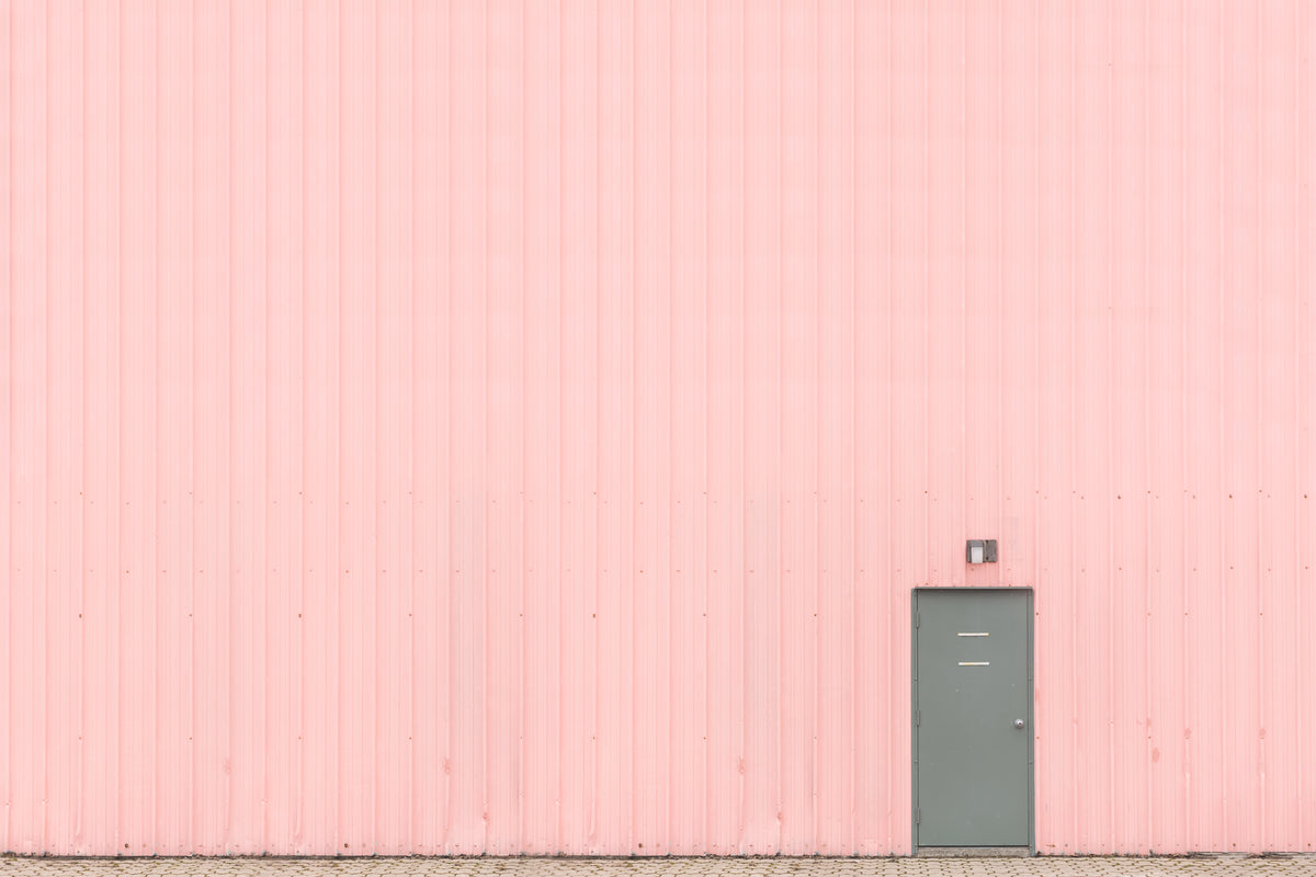 pink wall with grey door