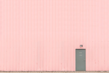 pink wall with grey door