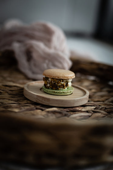 pistachio macaron on wicker tray