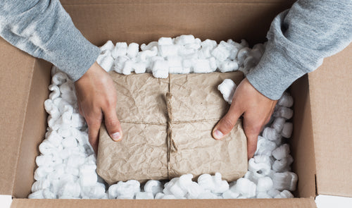 placing a package in packing material