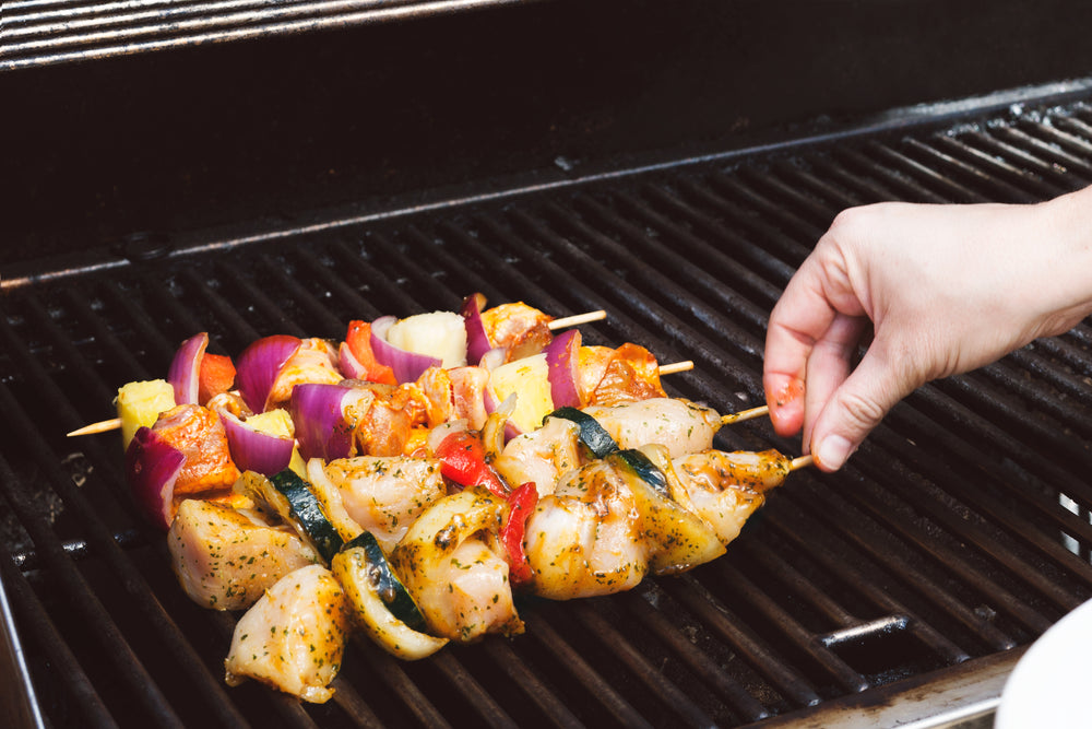 placing kababs on the bbq