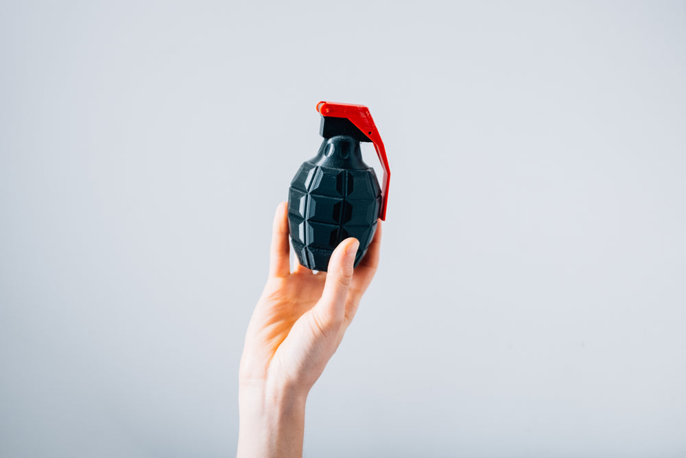 plastic grenade held in the hand