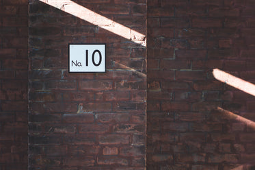 platform 10 sign on brick wall at station
