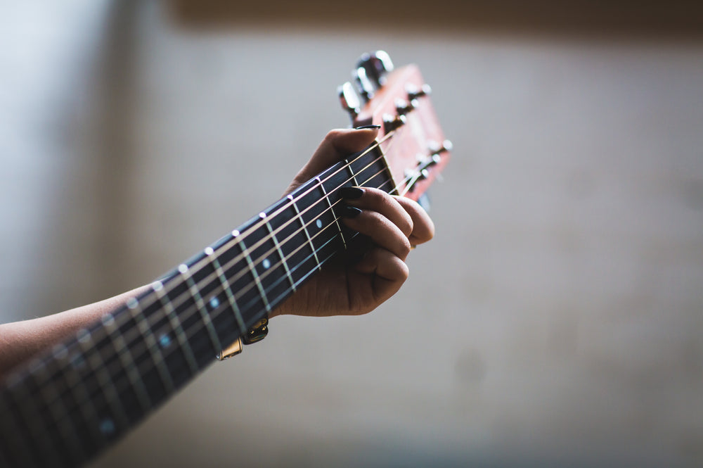 playing acoustic guitar