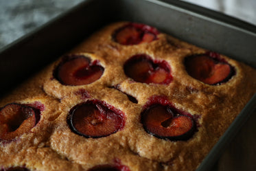 plum cake in a silver cake tray