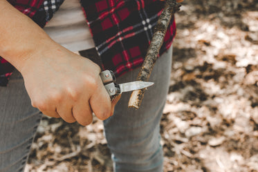 pocket knife sharpens stick