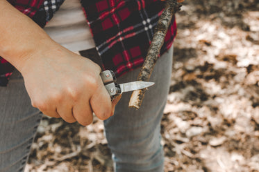 pocket knife sharpens stick