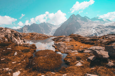 pond on a mountain range reflecting the mountain view