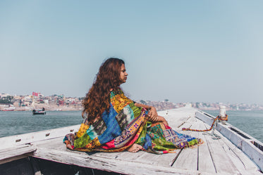 pondering woman in boat
