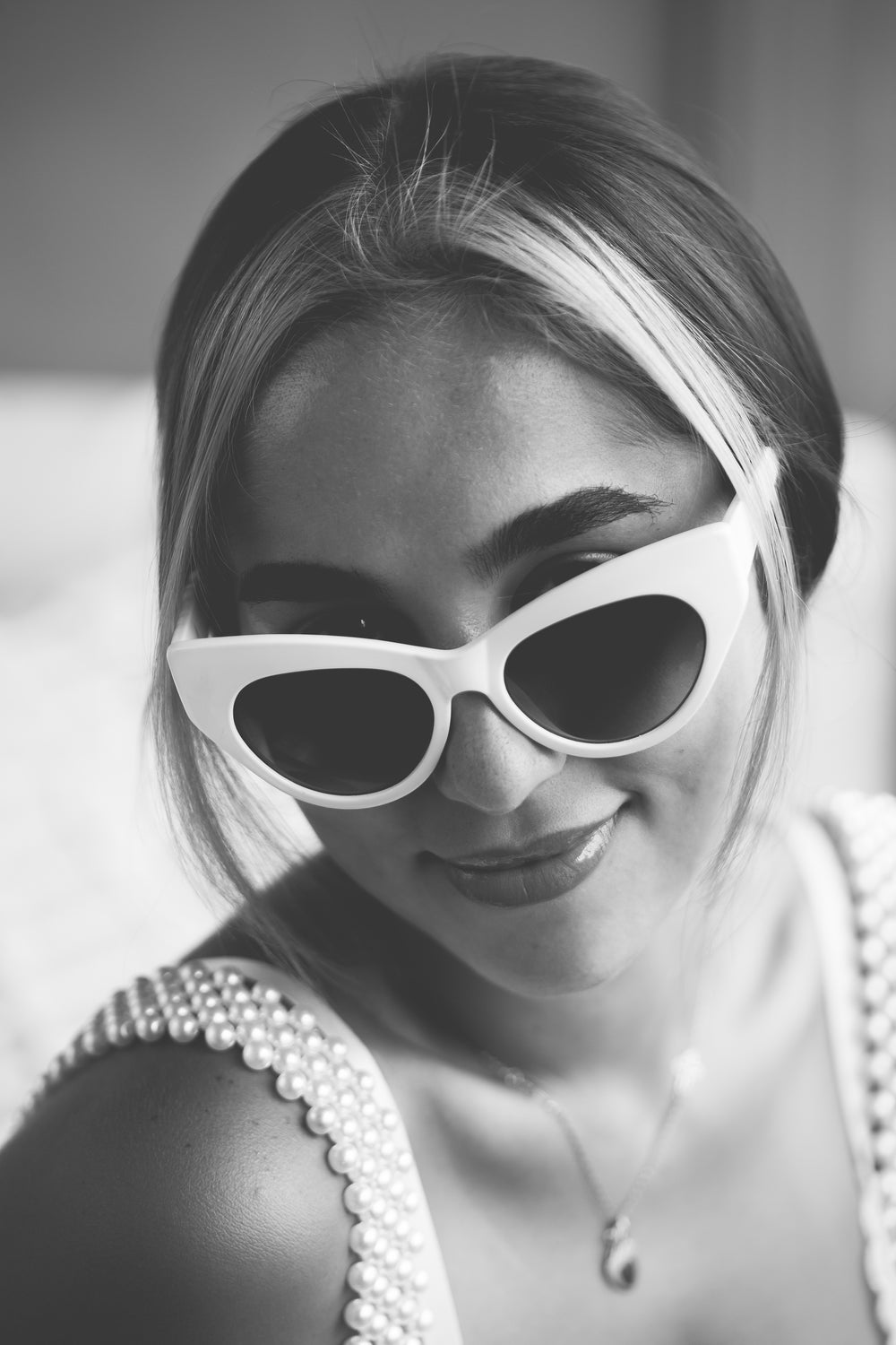 portrait in monochrome of woman in sunglasses