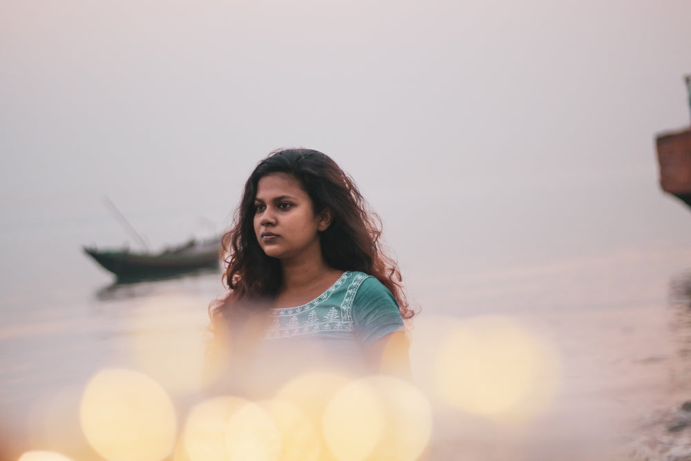 portrait of a person with yellow bokeh around them