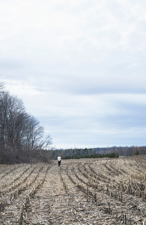 portrait of a woman alone in a field