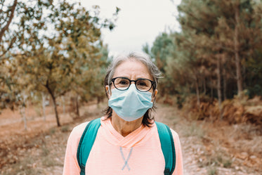 portrait of a woman outdoors wearing face mask