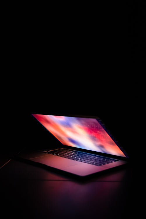 portrait of illuminated laptop