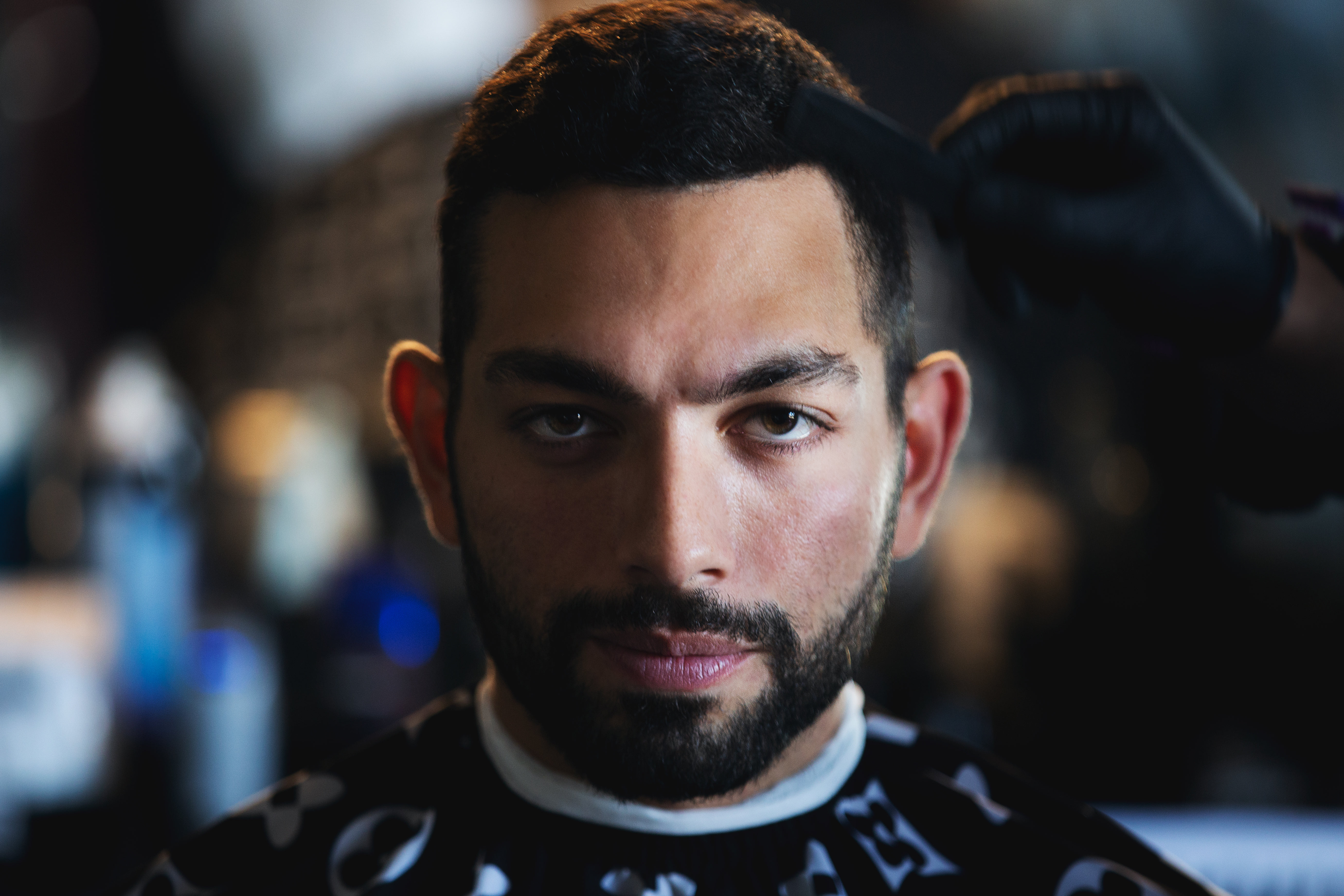 Portrait Of Man As The Barber Adds Final Touches