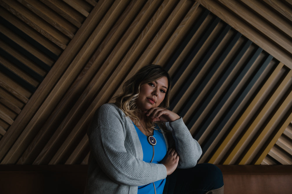 portrait of person against a wooden geometric wall