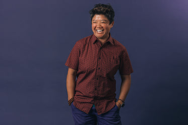 portrait of woman laughing hand in pockets