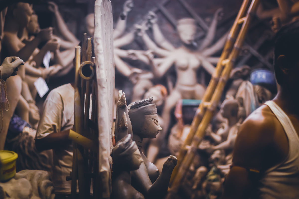 pottery studio filled with a variety of sacred sculptures