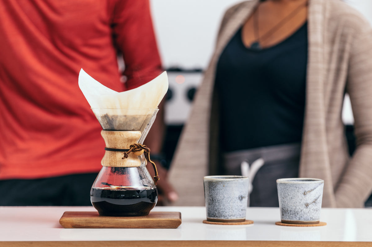 pour over coffee with two rustic cups