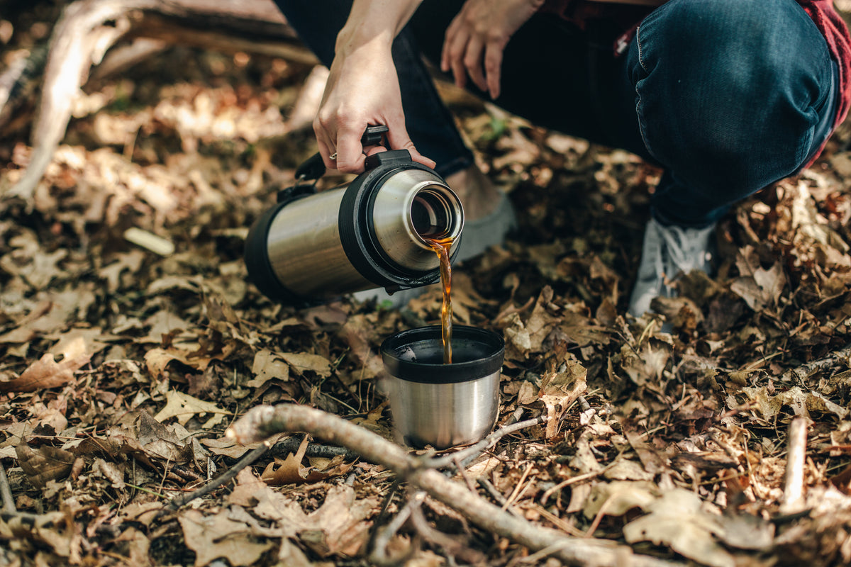 pouring coffee in the wilderness