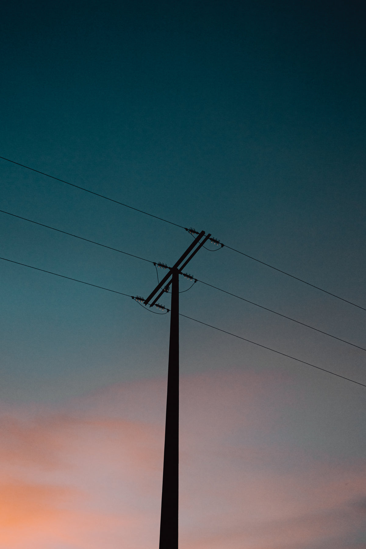 power lines under blue and pink sky