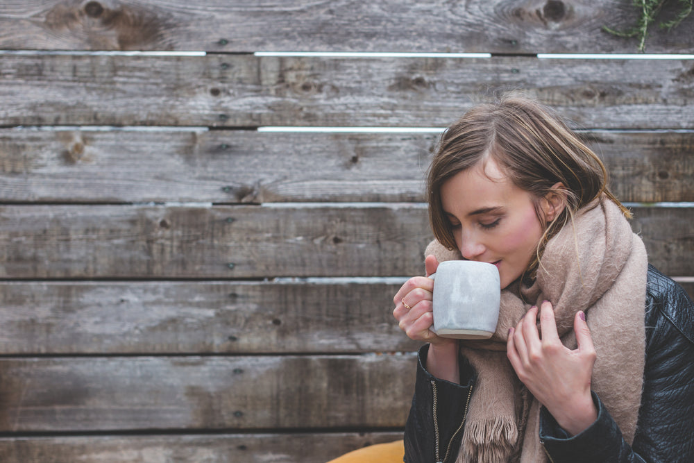 woman sipping coffee