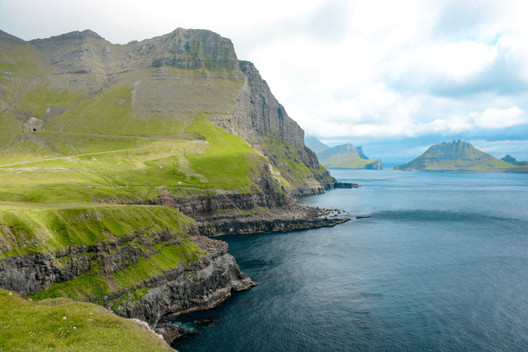Pristine Mountainous Coastline Off Faroe Islands
