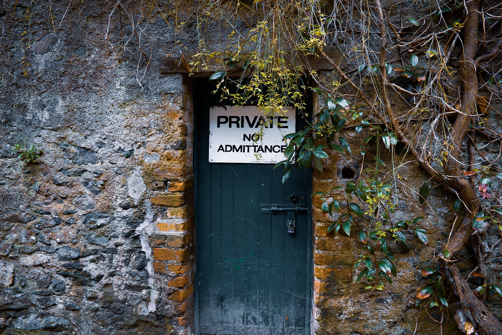 private door hidden in stone building