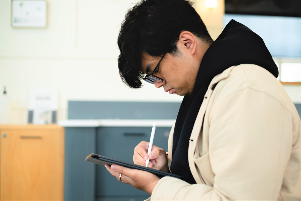 profile of a man working in a tablet