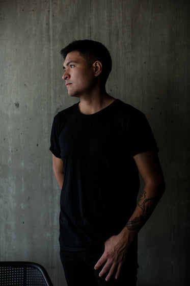 profile of a person in black tee