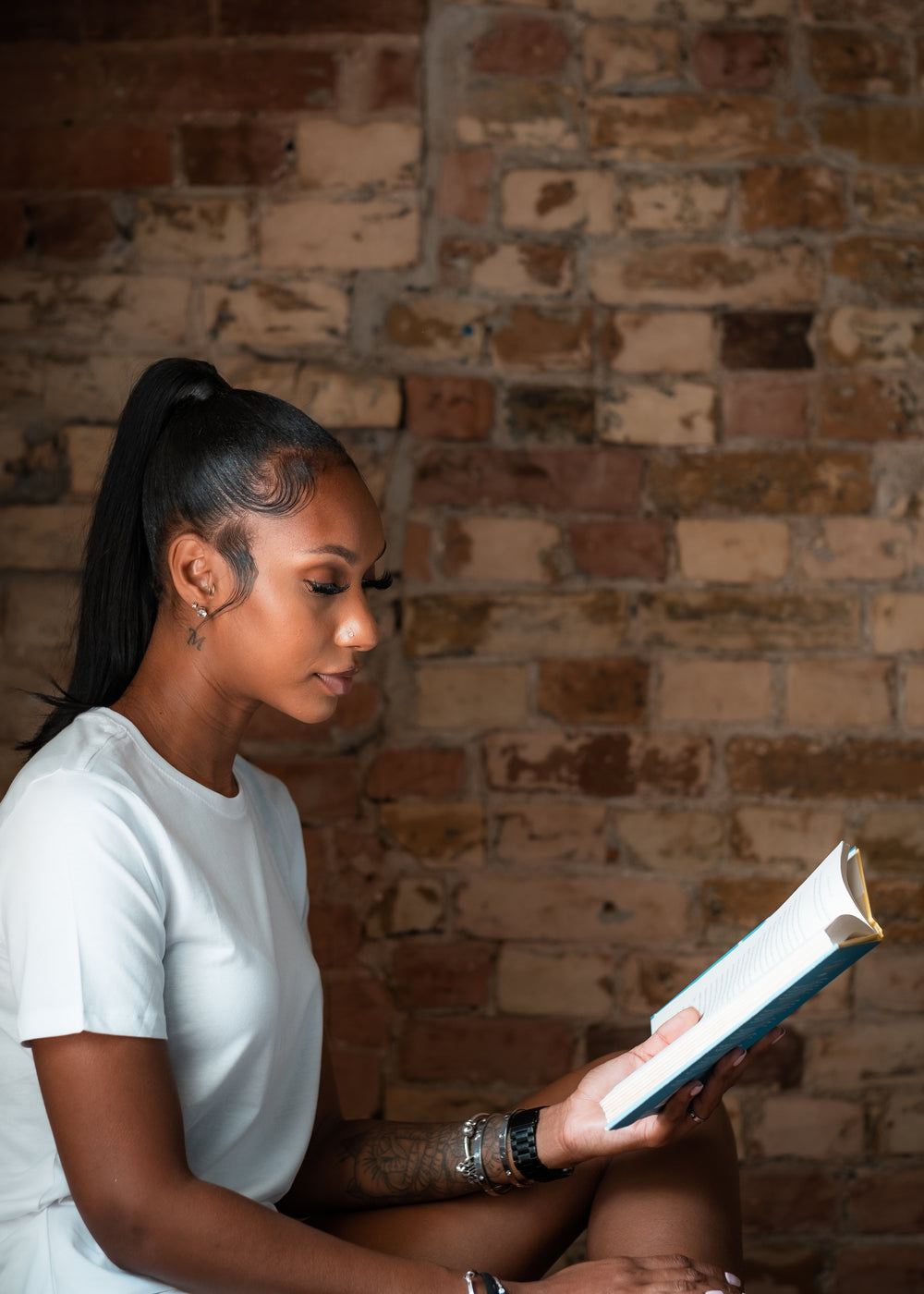 profile of a woman reading a book