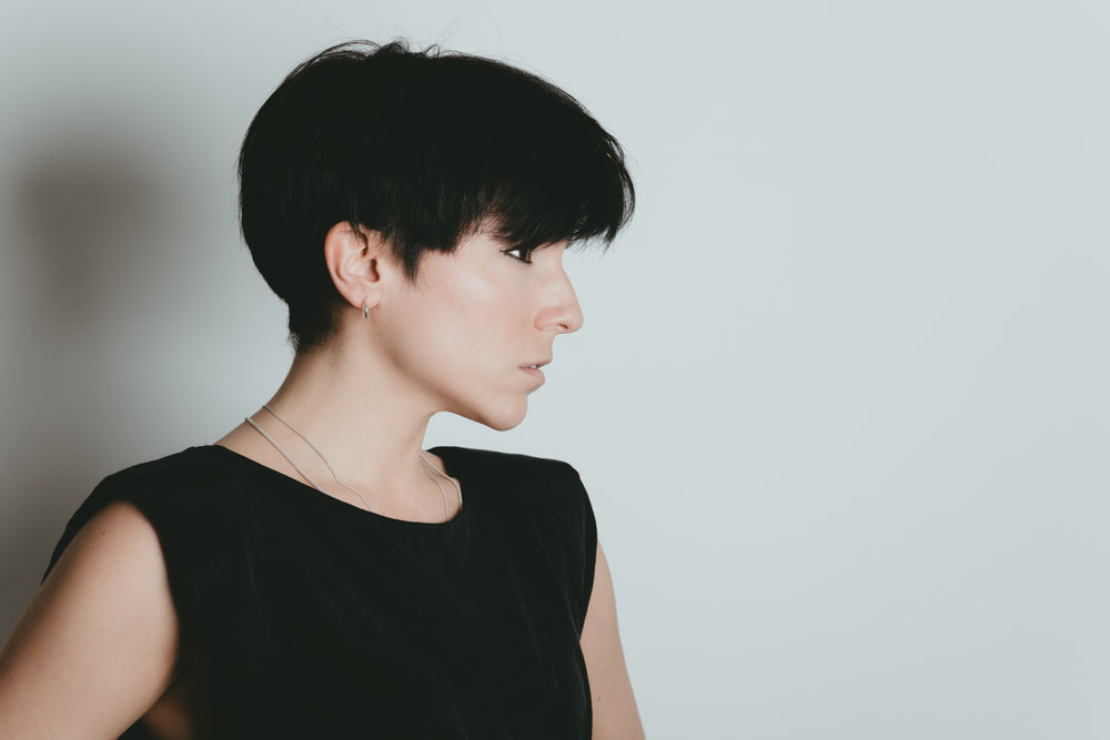 profile of women with short black hair