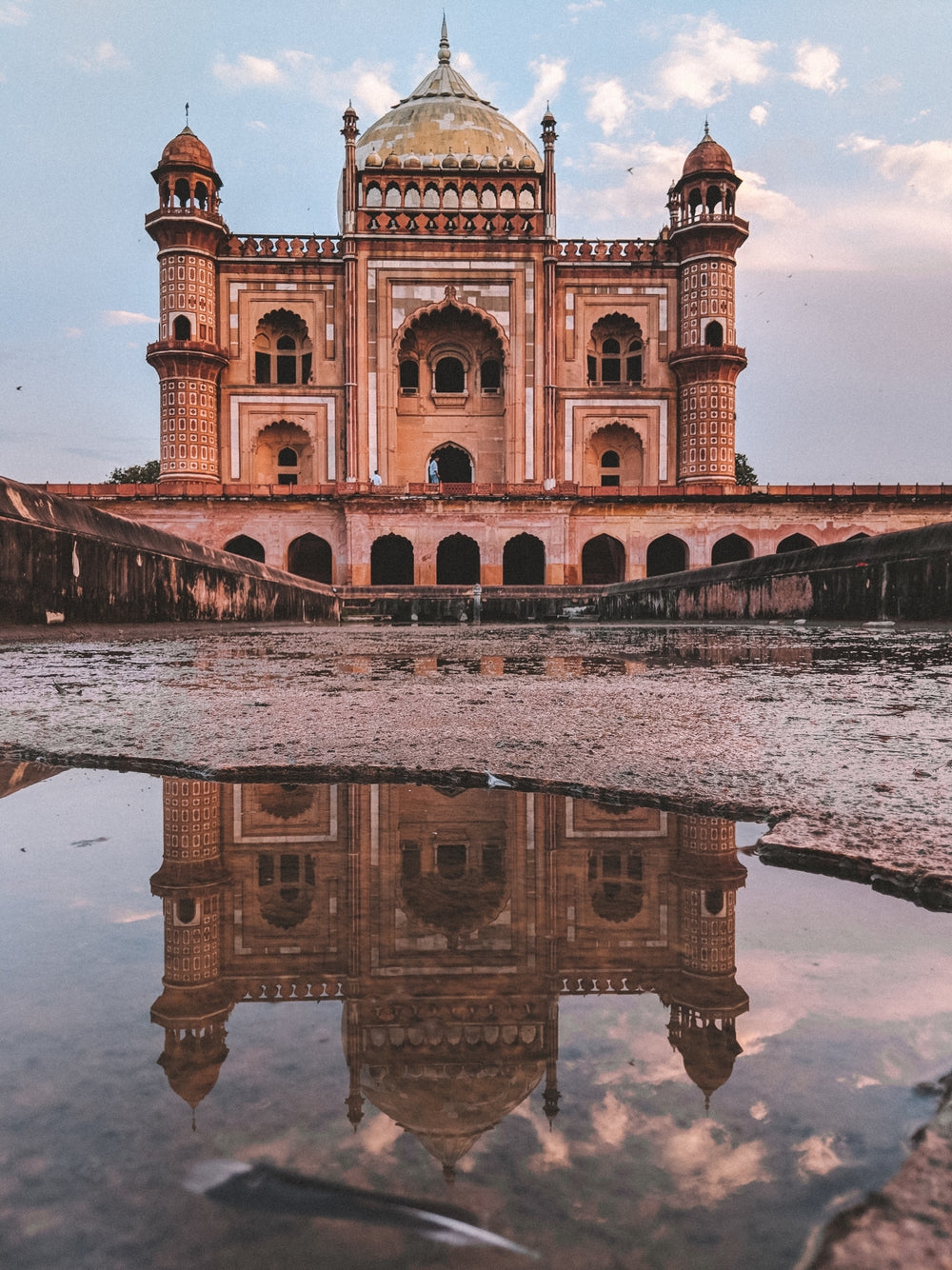 puddle reflects mosque