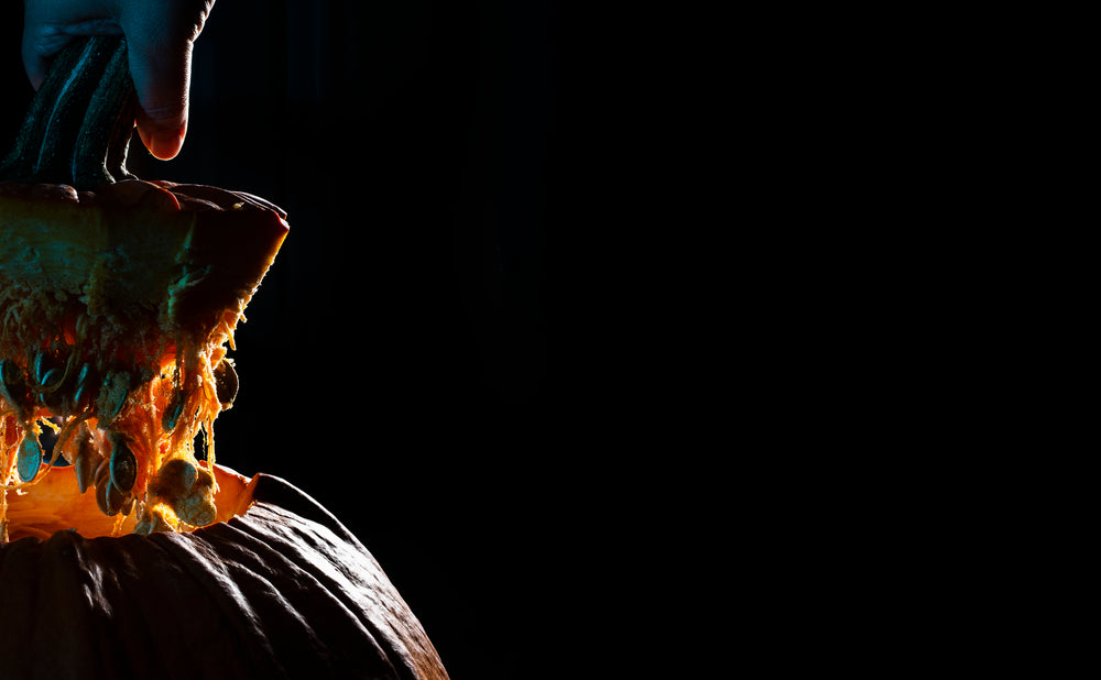 pumpkin lid and guts on a black background