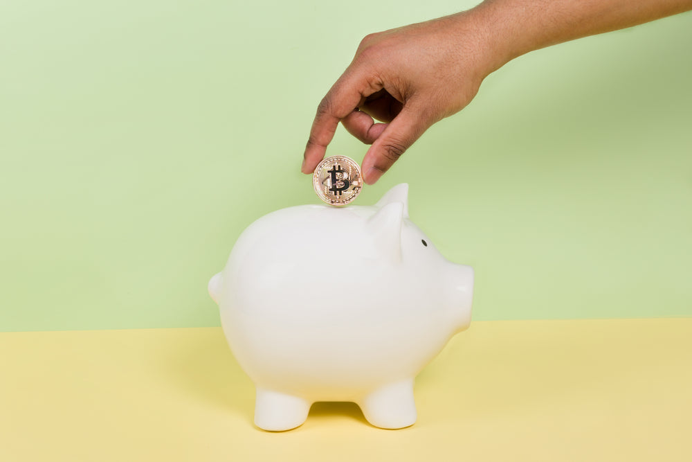 putting bitcoin into piggy bank