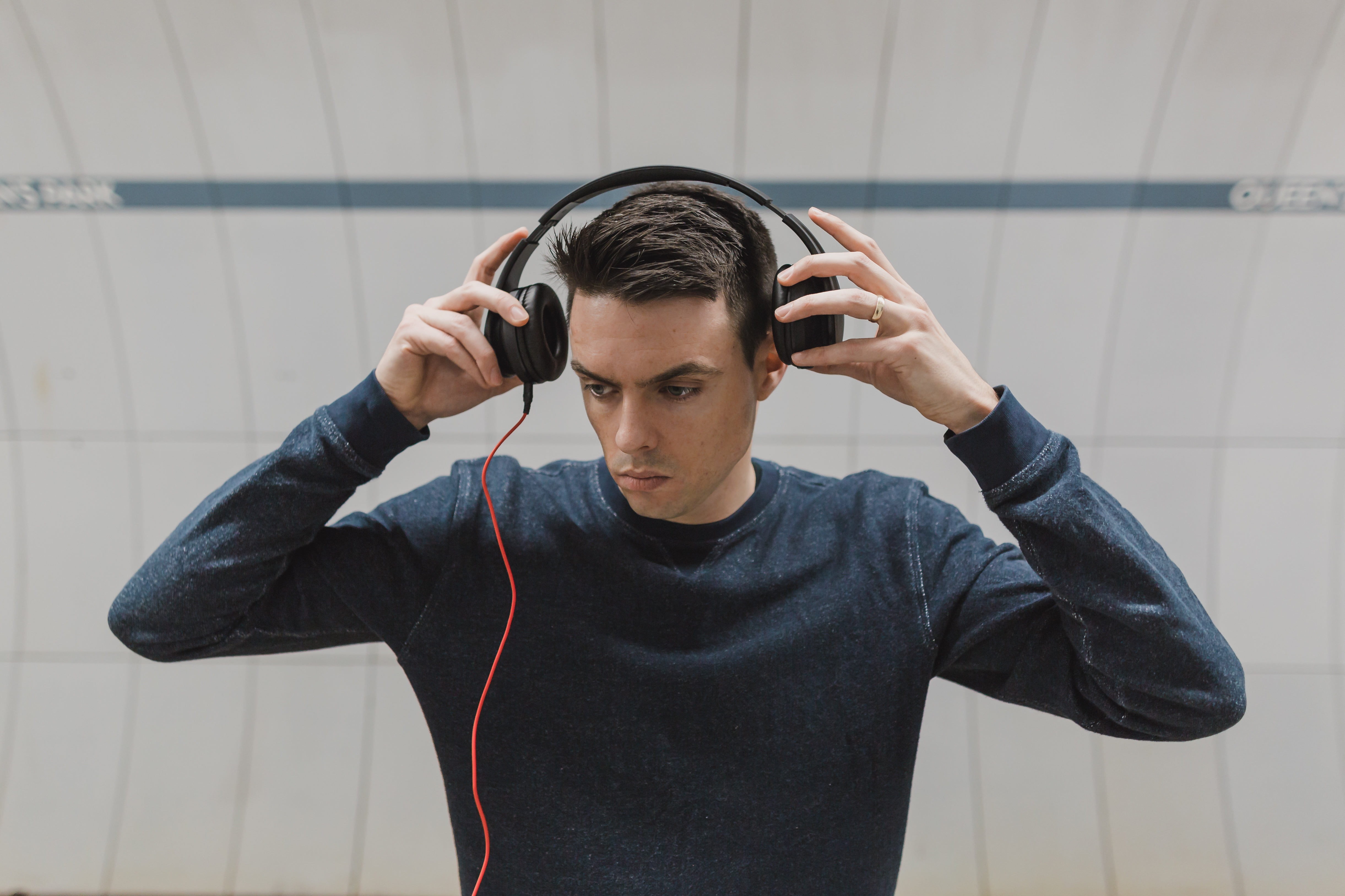 Picture of Putting On Headphones Free Stock Photo