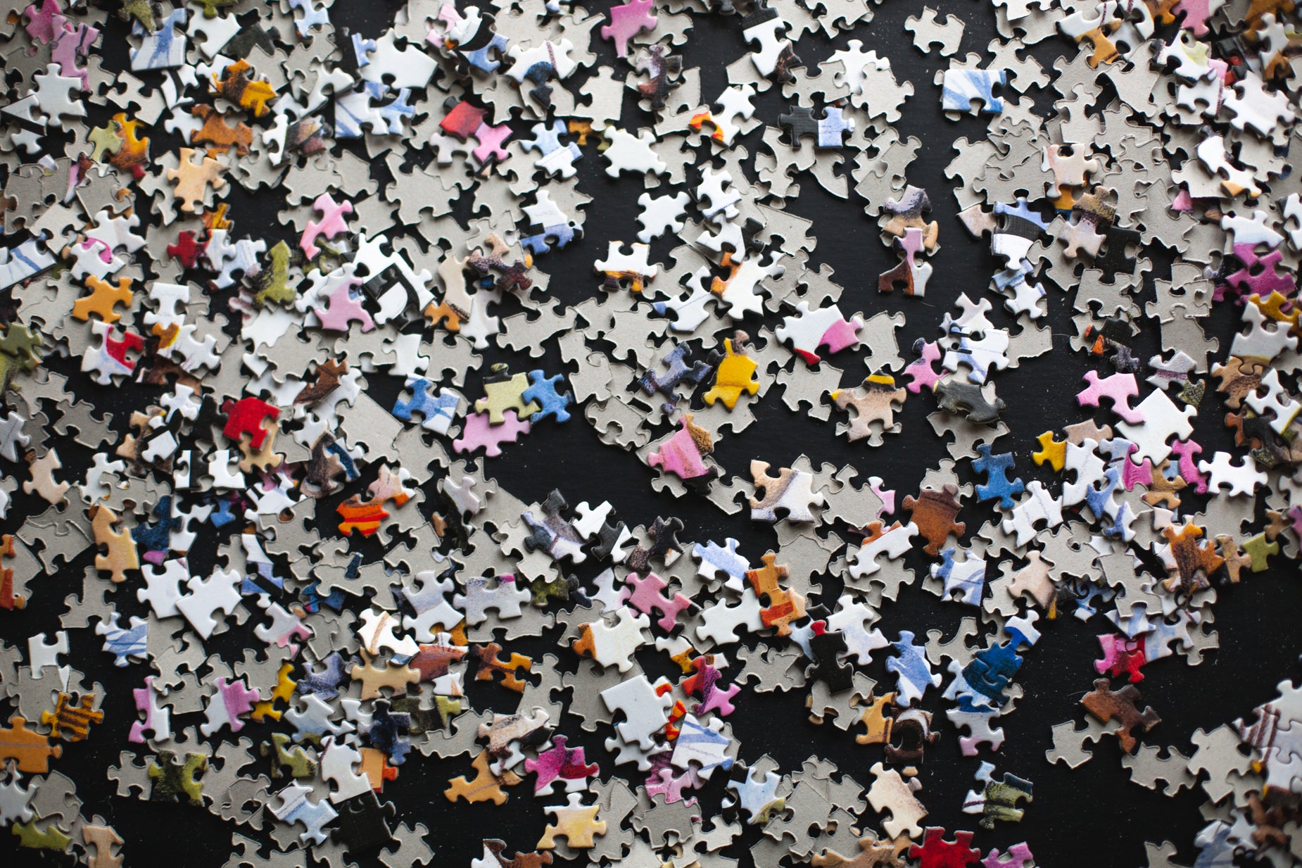 Browse Free HD Images of Puzzle Pieces On A Black Background