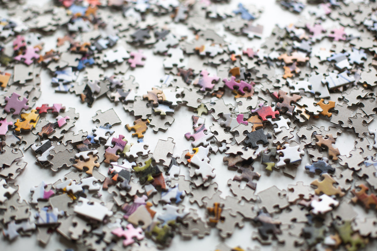 puzzle pieces scattered across a surface