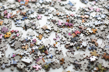 puzzle pieces scattered across a surface