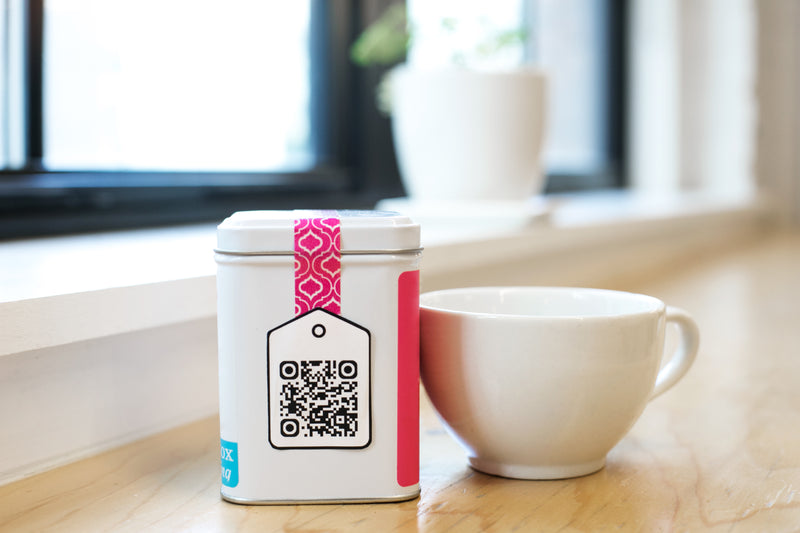 qr code on tea - a cup and a mug on a table